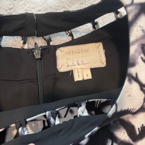 New! Nicole Miller Artelier black and white, lined cutout dress
NWT! Size 2 - Picture 11 of 11